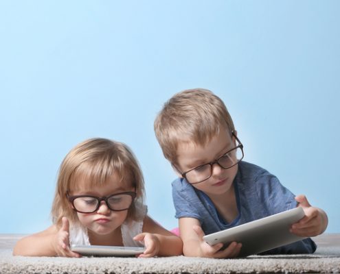 children looking at tablets