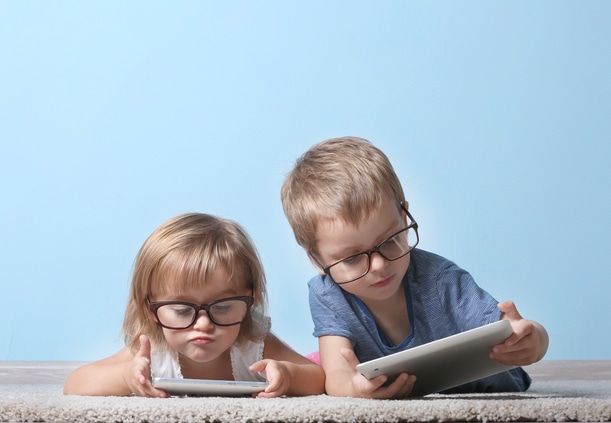 children looking at tablets