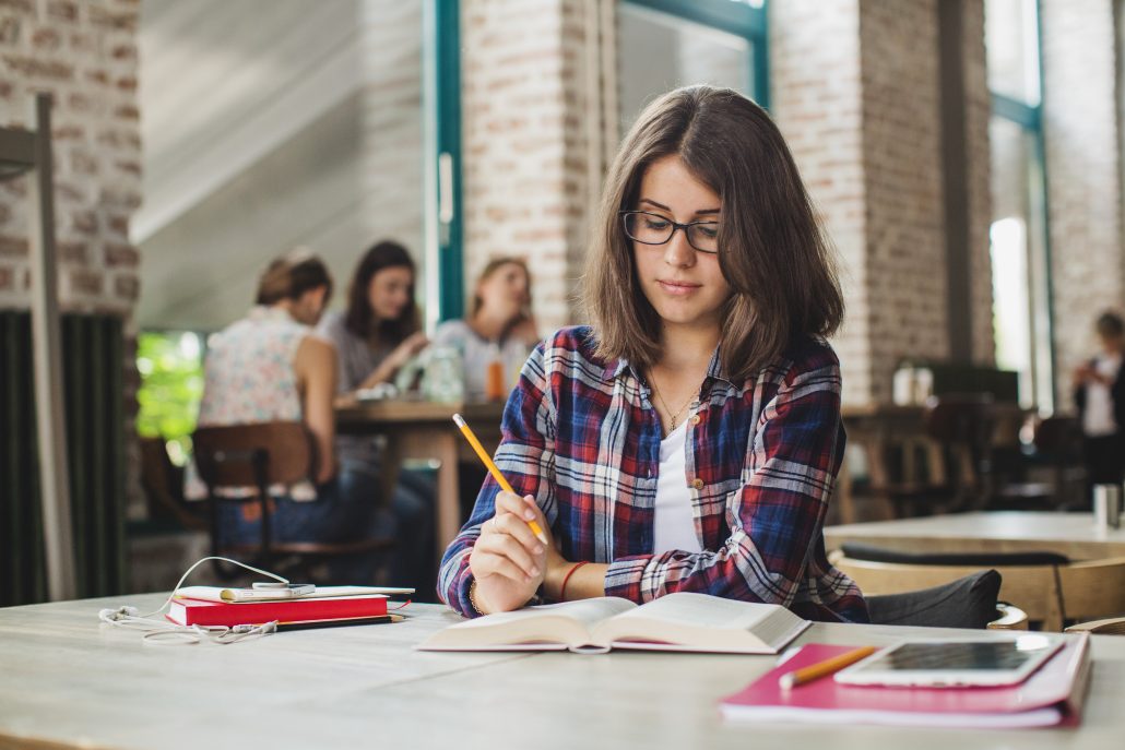College student with glasses studying